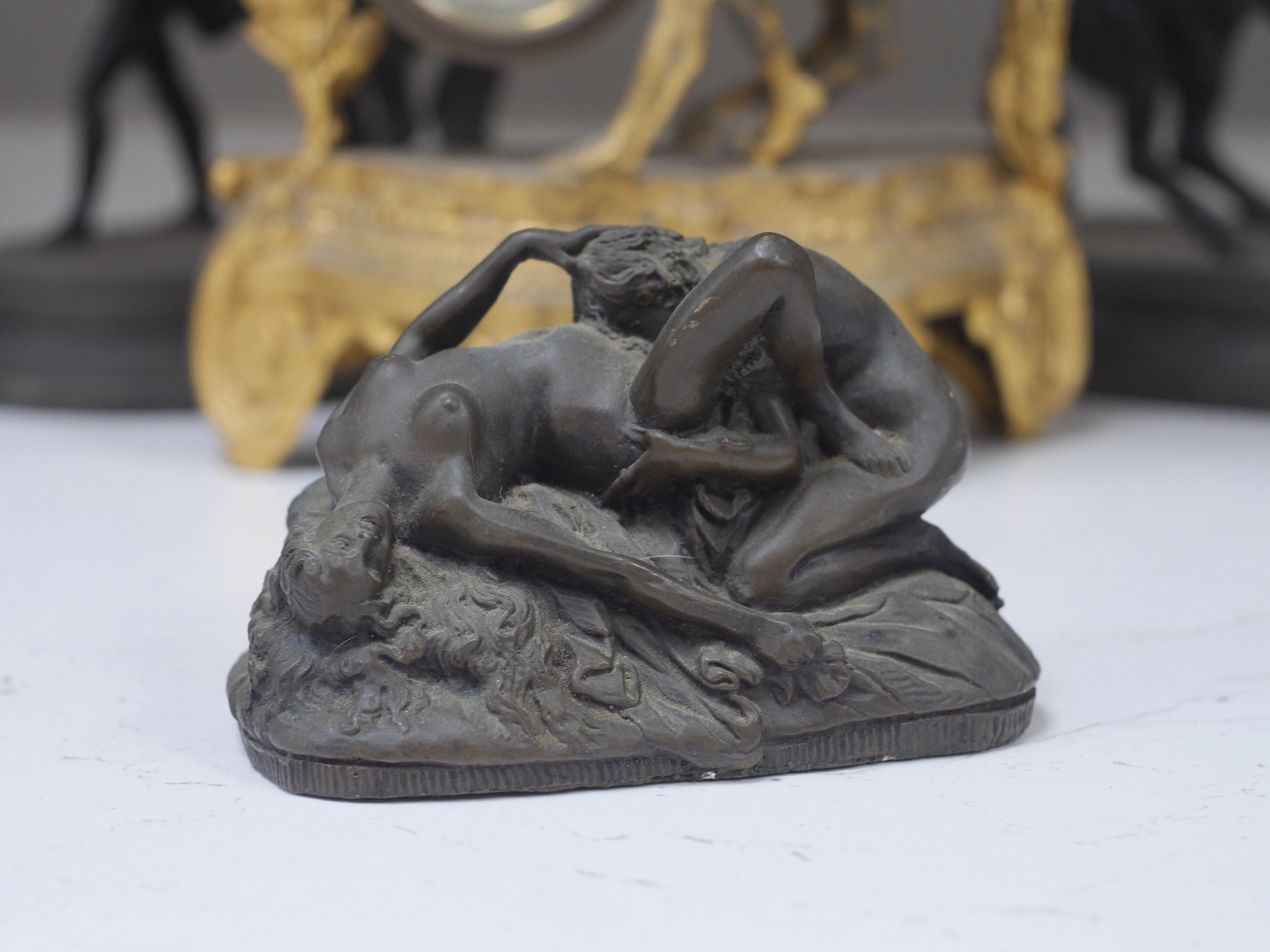 Two Spelter Marley horse groups, a similar timepiece and a bronzed resin erotic figure group after Jef Lambeaux (1852-1908), largest 24cm. Condition - fair